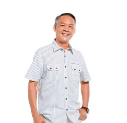 Portrait of a man smiling wearing a white shirt