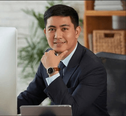 Portrait of a man smiling wearing a suit and tie